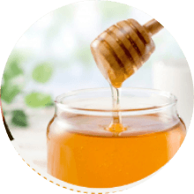 Dripping golden honey jar