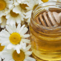 Honey jar with chamomile daisies