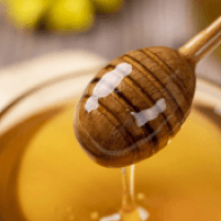 Dipper dripping honey
